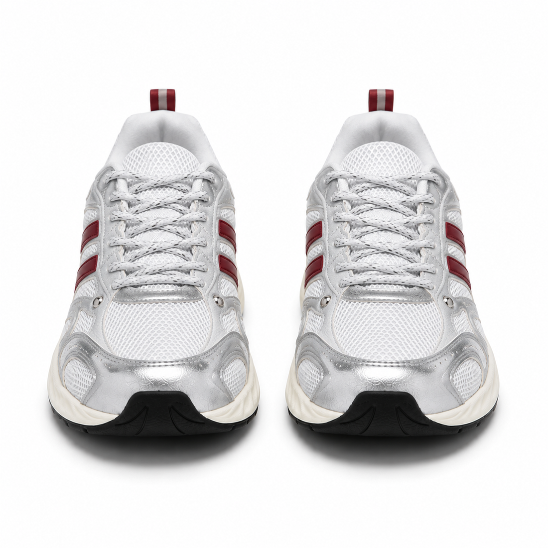 A pair of white and metallic silver running shoes with red side stripes and a black outsole, shown from a front-facing perspective on a white background.