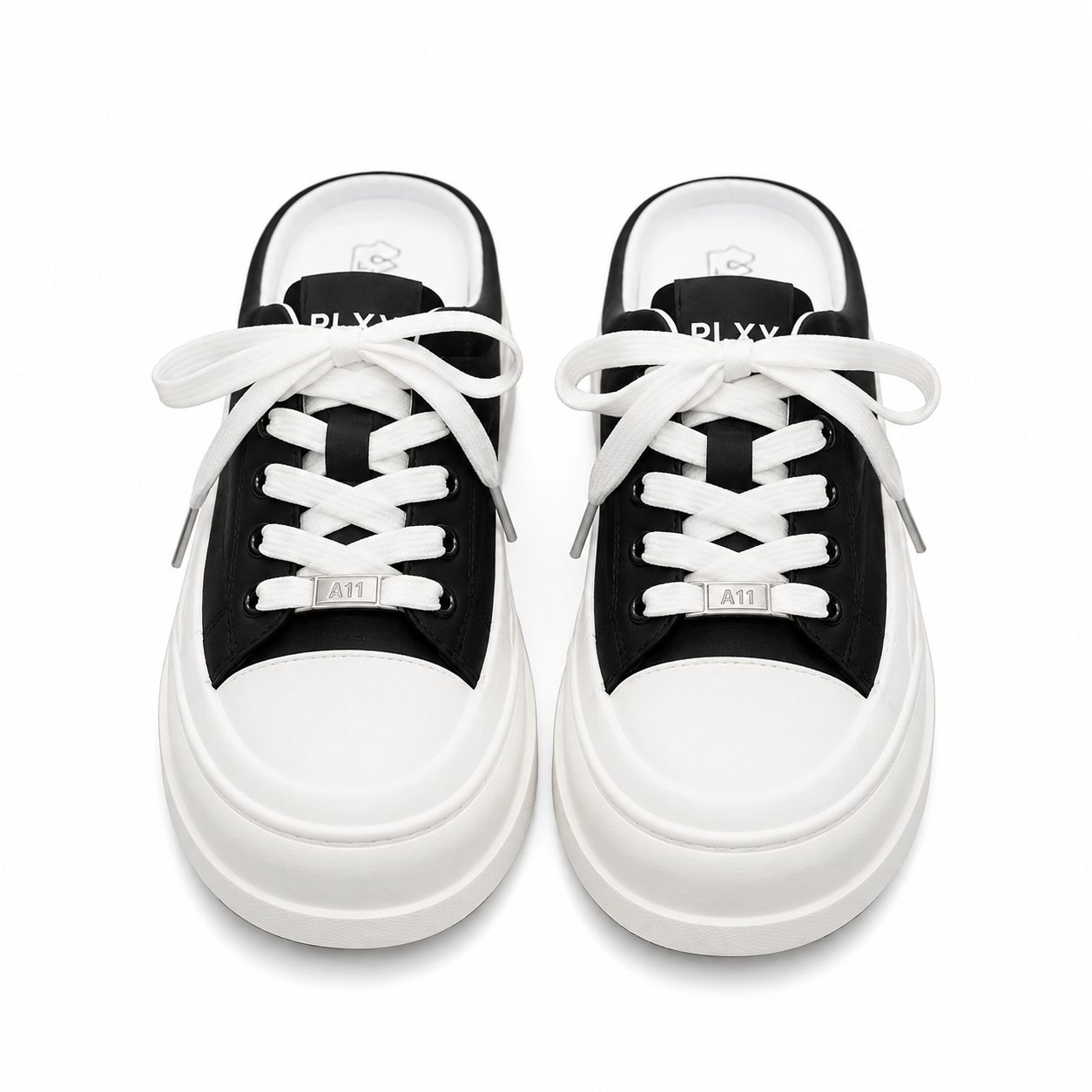 Women's black platform mule sneakers with chunky sole and lace-up front.