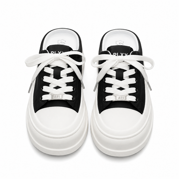 Women's black platform mule sneakers with chunky sole and lace-up front.