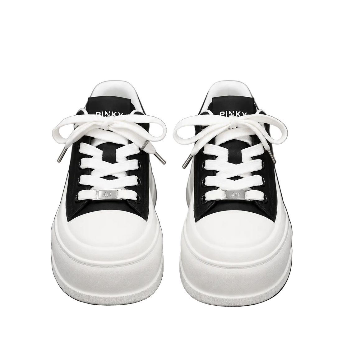 Women's black and white platform sneakers with thick sole and lace-up design.