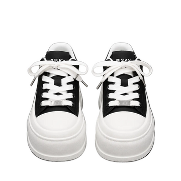 Women's black and white platform sneakers with thick sole and lace-up design.