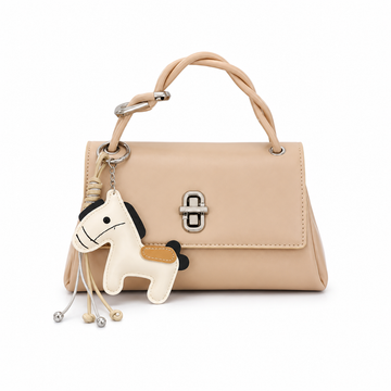 Apricot structured top handle handbag with silver twist-lock closure and decorative horse charm on a white studio background.