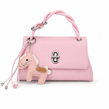 Pink structured top handle handbag with silver twist-lock closure and decorative pink horse charm on a white studio background.