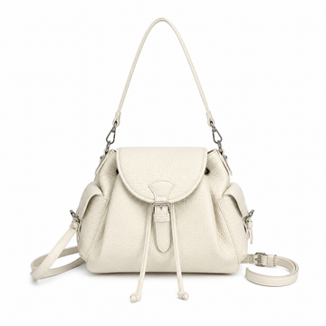 Off White textured leather-look shoulder bag with flap closure, side pockets, adjustable shoulder strap, and detachable crossbody strap on a white background.