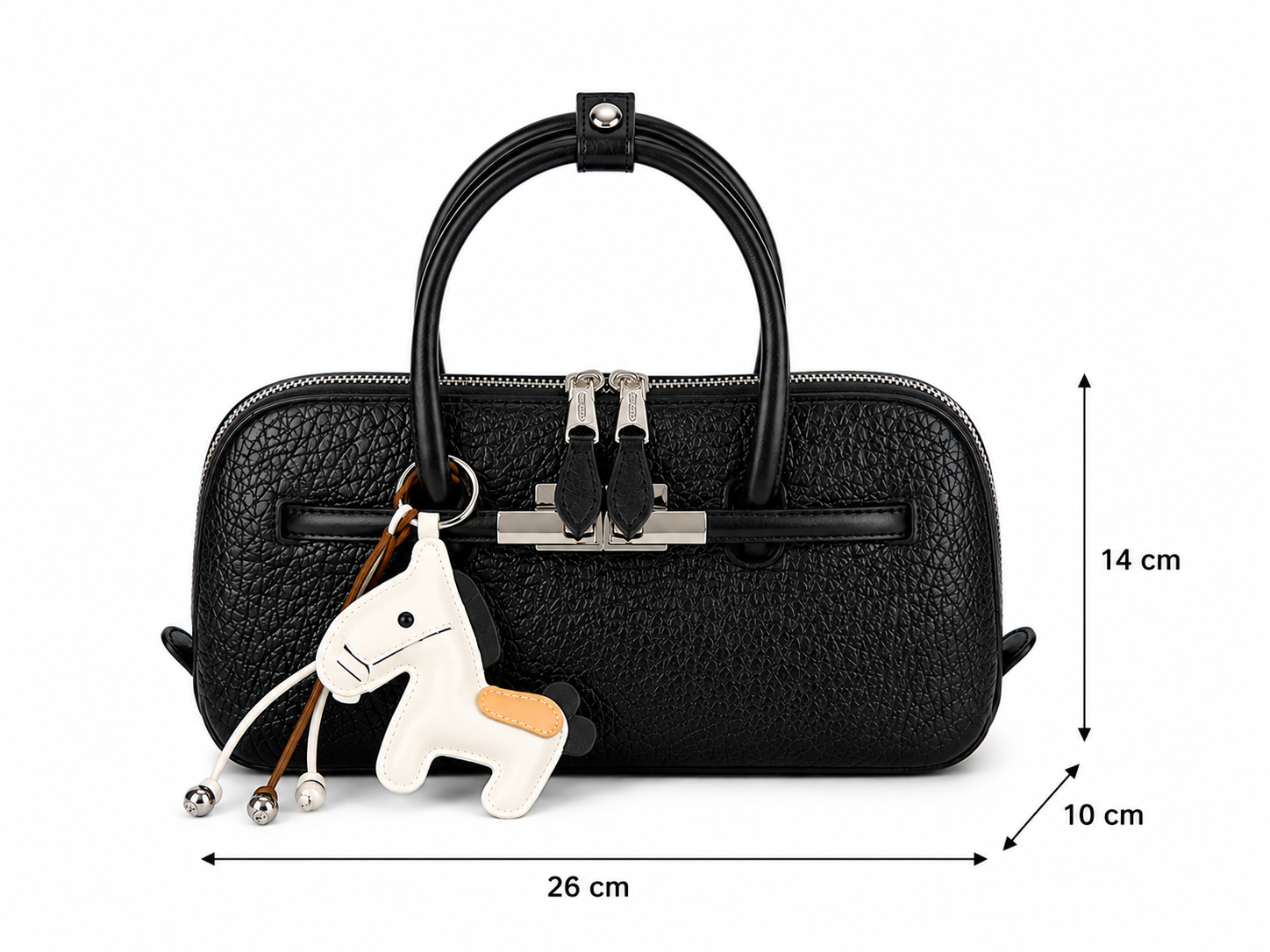 Black textured leather handbag with a top handle, silver-tone front hardware, and a white horse-shaped keychain charm, shown with dimension arrows and labels indicating 26 cm width, 14 cm height, and 10 cm depth on a white background.