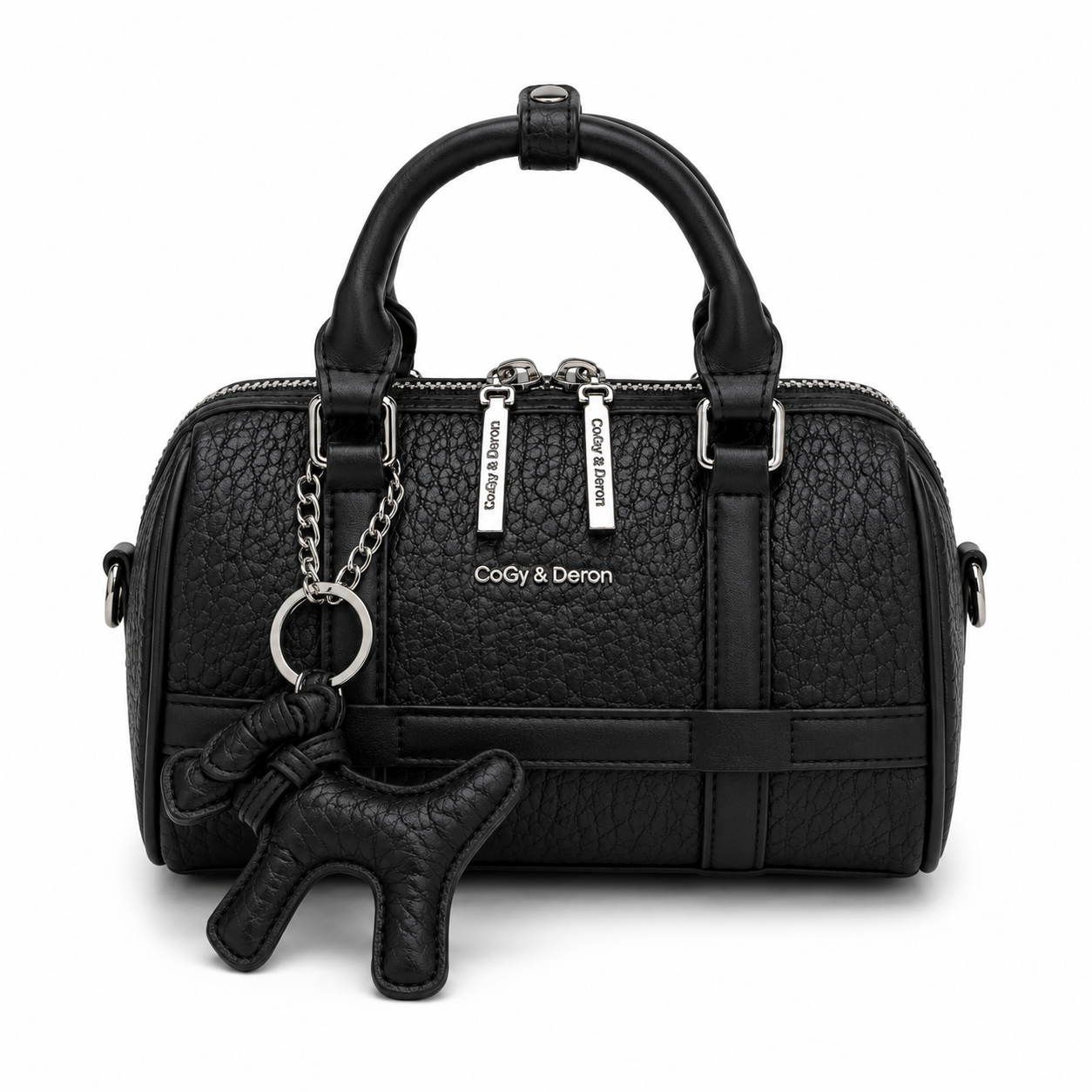 Front view of a black mini Boston handbag with textured leather, dual top handles, silver hardware, and a matching black dog charm, photographed in a professional studio on a clean white background.