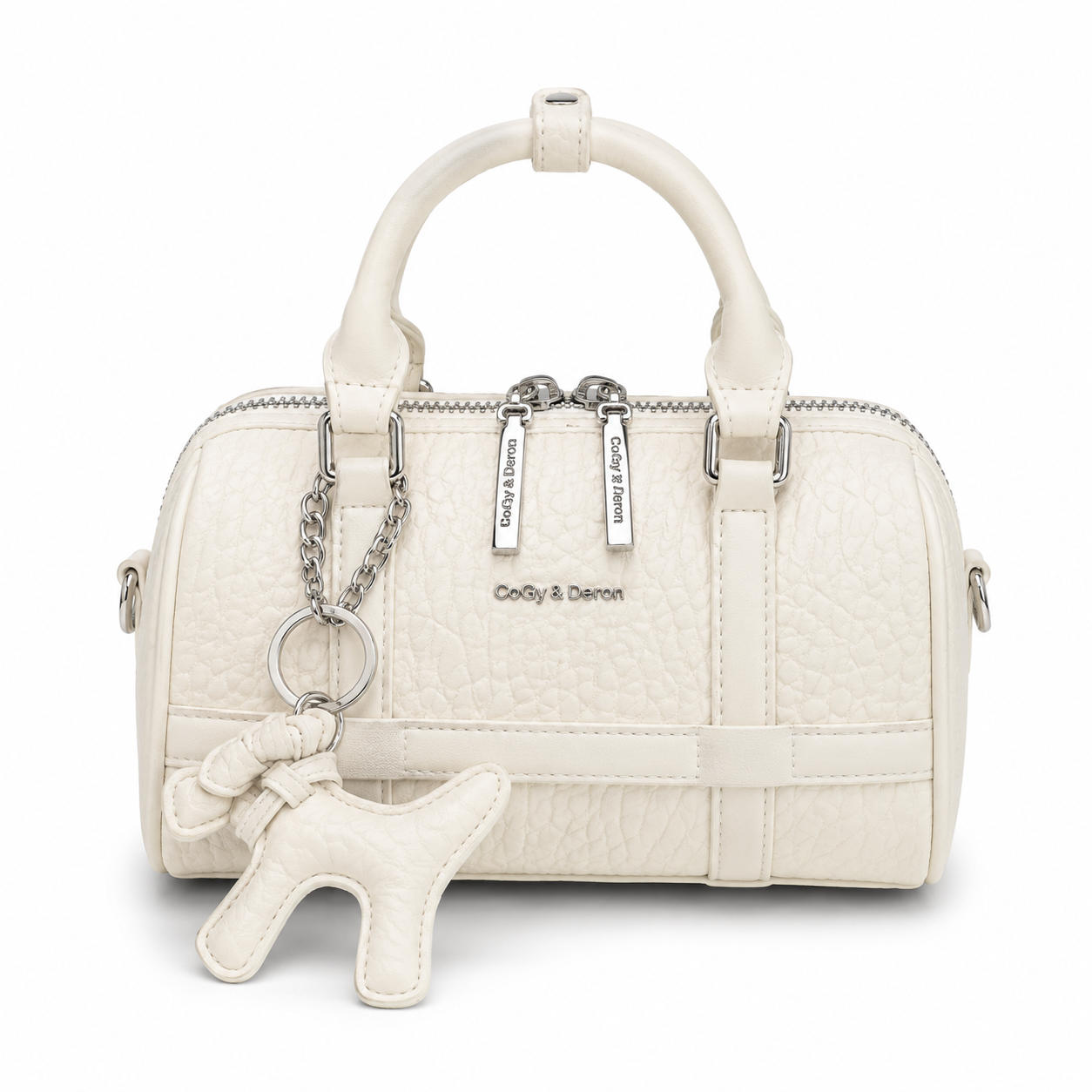 Front view of a white mini Boston handbag with textured leather, dual top handles, silver hardware, and a matching dog charm, photographed in a professional studio on a clean white background.