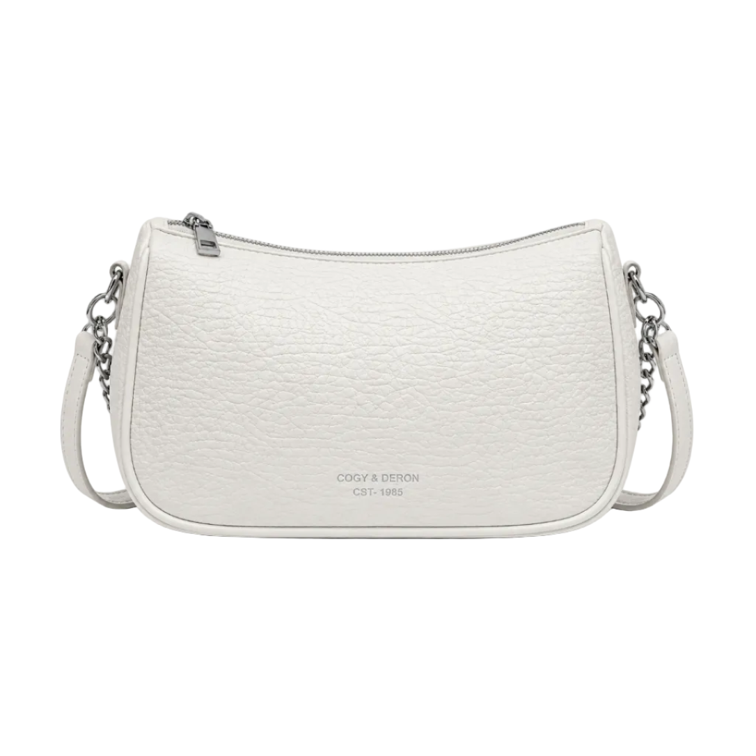 Front view of a white textured shoulder bag with silver chain accents and a curved silhouette, photographed in a professional studio on a clean white background.
