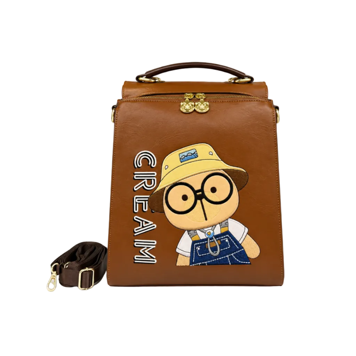 Brown Cream Bear square backpack with embroidered cartoon bear wearing a bucket hat, top handle, detachable shoulder strap, and white studio background.
