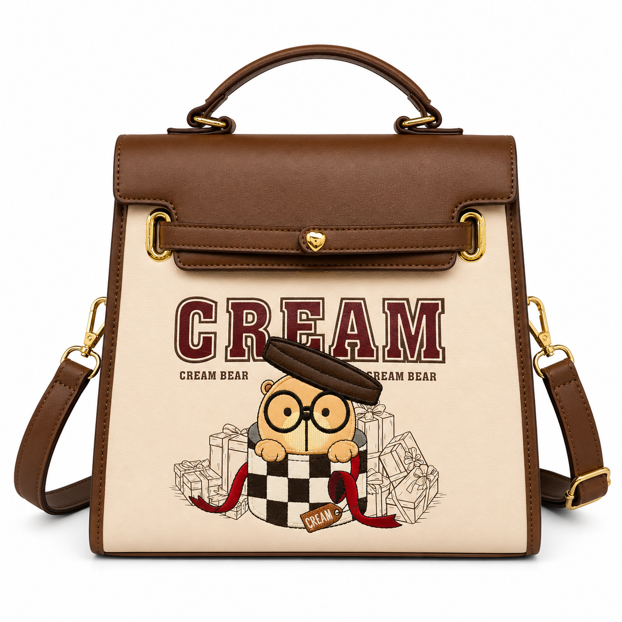 Beige and brown Cream Bear square handbag with embroidered bear character, top handle, structured silhouette, gold-tone hardware, and white studio background.