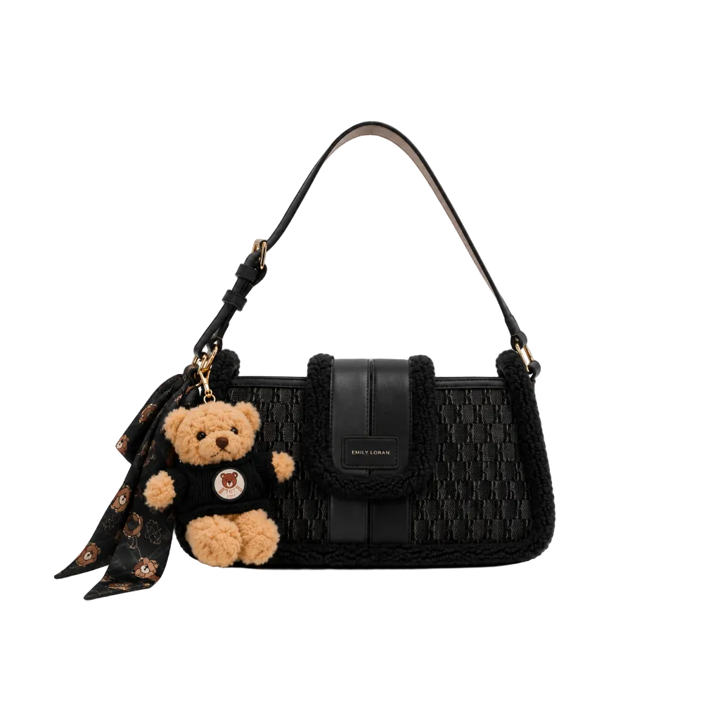 EMILY LORAN black monogram shoulder bag with soft sherpa trim, adjustable shoulder strap, gold-tone hardware, and decorative teddy bear charm for everyday fashion. 