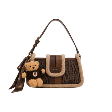 EMILY LORAN dark brown monogram shoulder bag with soft sherpa trim, adjustable shoulder strap, gold-tone hardware, and decorative teddy bear charm for everyday fashion.