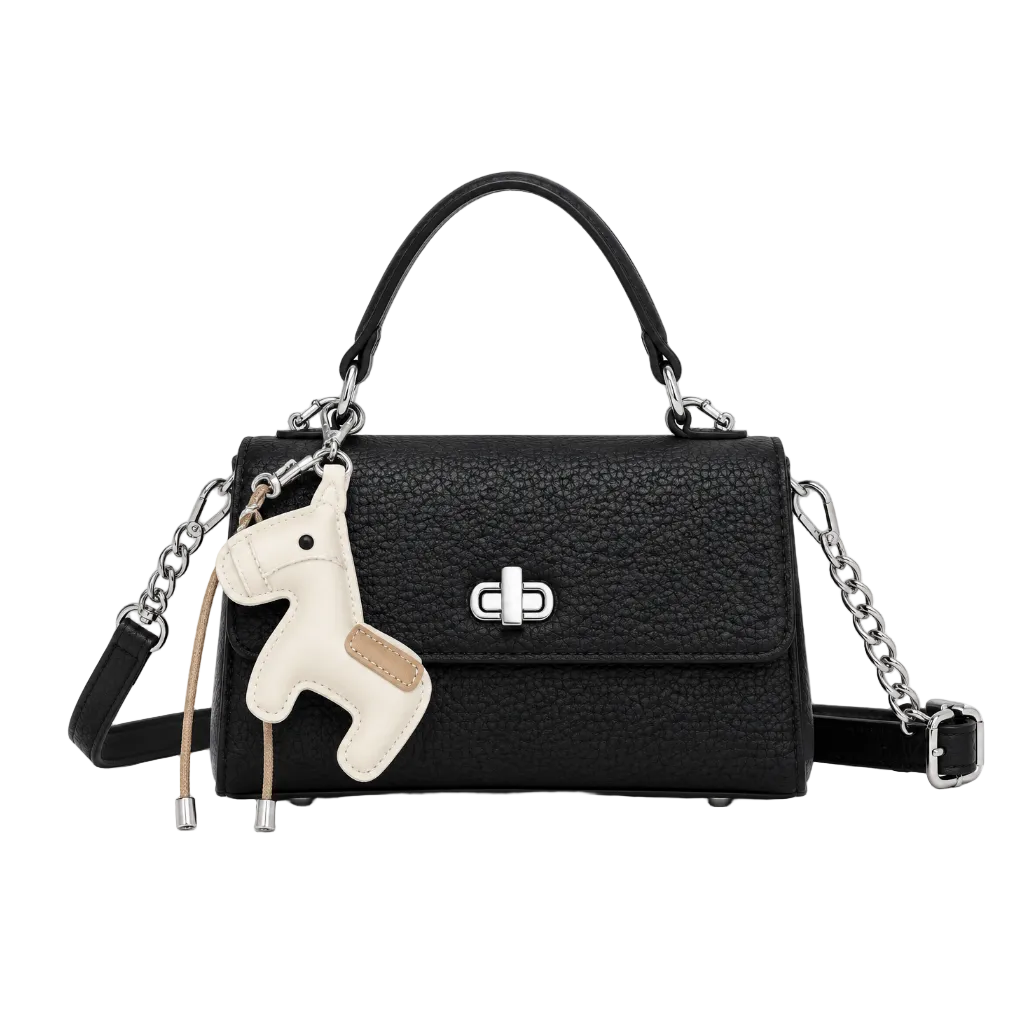 Front view of a black textured top handle handbag with a silver turn-lock closure, chain shoulder strap, and horse charm, photographed in a professional studio on a clean white background.