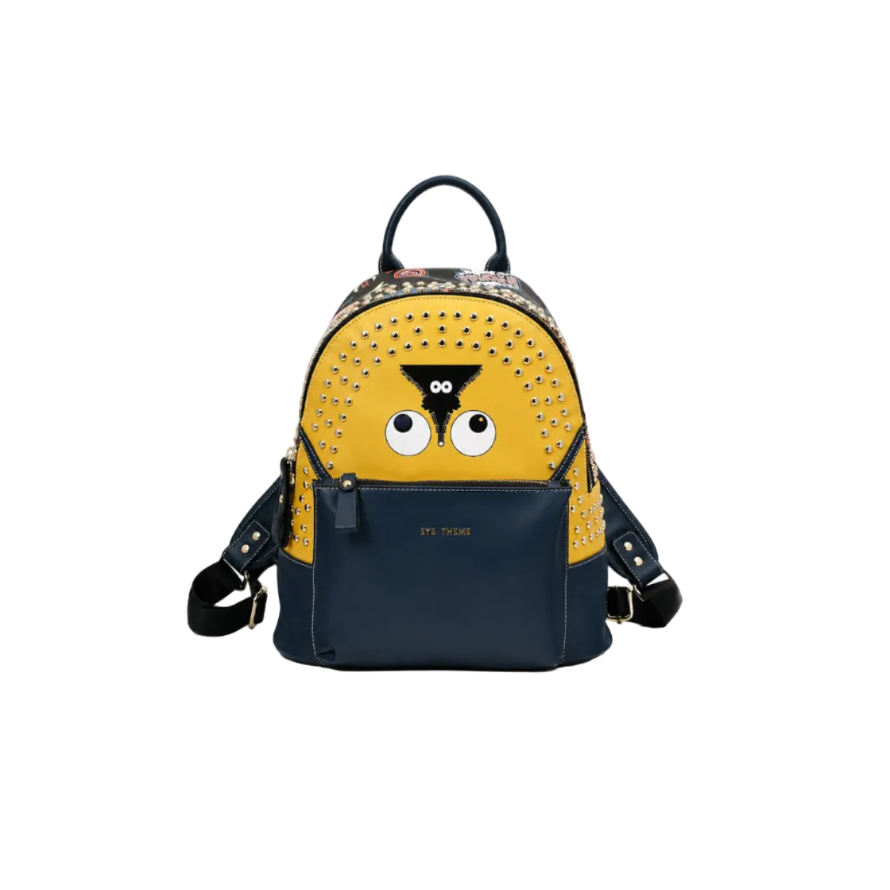 Yellow and navy backpack with cartoon eye design, silver-tone studs, front zip pocket, top handle, and adjustable shoulder straps on a white studio background.