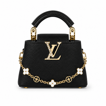 Louis Vuitton Capucines small black leather handbag with pearl-detailed gold LV logo, floral gold charm chain, structured top handle, and luxury designer styling.