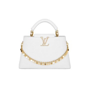 Louis Vuitton Capucines medium white leather handbag with gold LV logo, decorative gold charm chain, structured top handle, and elegant luxury designer style.