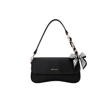 MISS ALITA black shoulder bag featuring a curved silhouette, gold-tone chain wrapped with a printed scarf, decorative bow accent, and a premium minimalist design.
