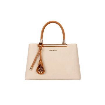 MISS ALITA structured ivory handbag with camel top handles, gold-tone hardware, decorative charm, and spacious interior for everyday elegance.