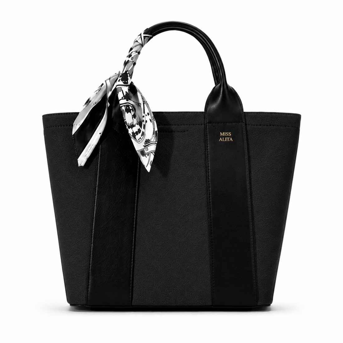MISS ALITA black canvas tote handbag with leather trim, decorative black and white silk scarf handle, and structured design on a white background.