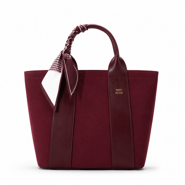MISS ALITA burgundy canvas tote handbag with leather trim, burgundy silk scarf handle, structured design, and gold logo on a white background.