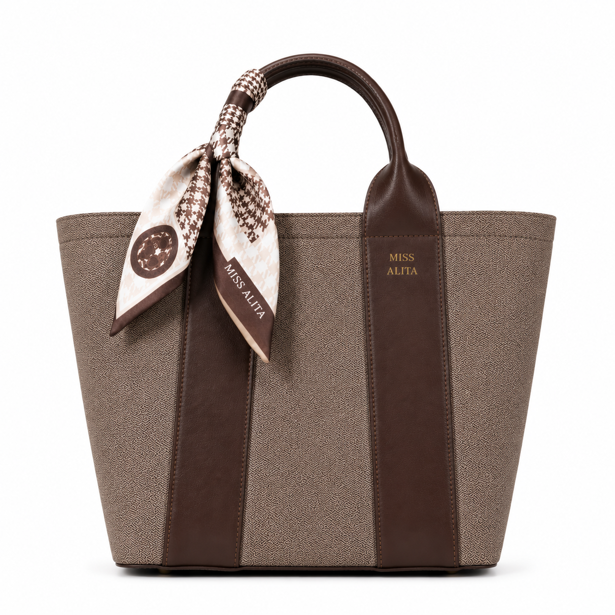 MISS ALITA dark brown canvas tote handbag with leather trim, decorative silk scarf handle, structured design, and gold logo on a white background.