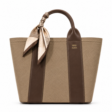MISS ALITA dark khaki canvas tote handbag with dark brown leather trim, decorative silk scarf handle, structured design, and gold logo on a white background.