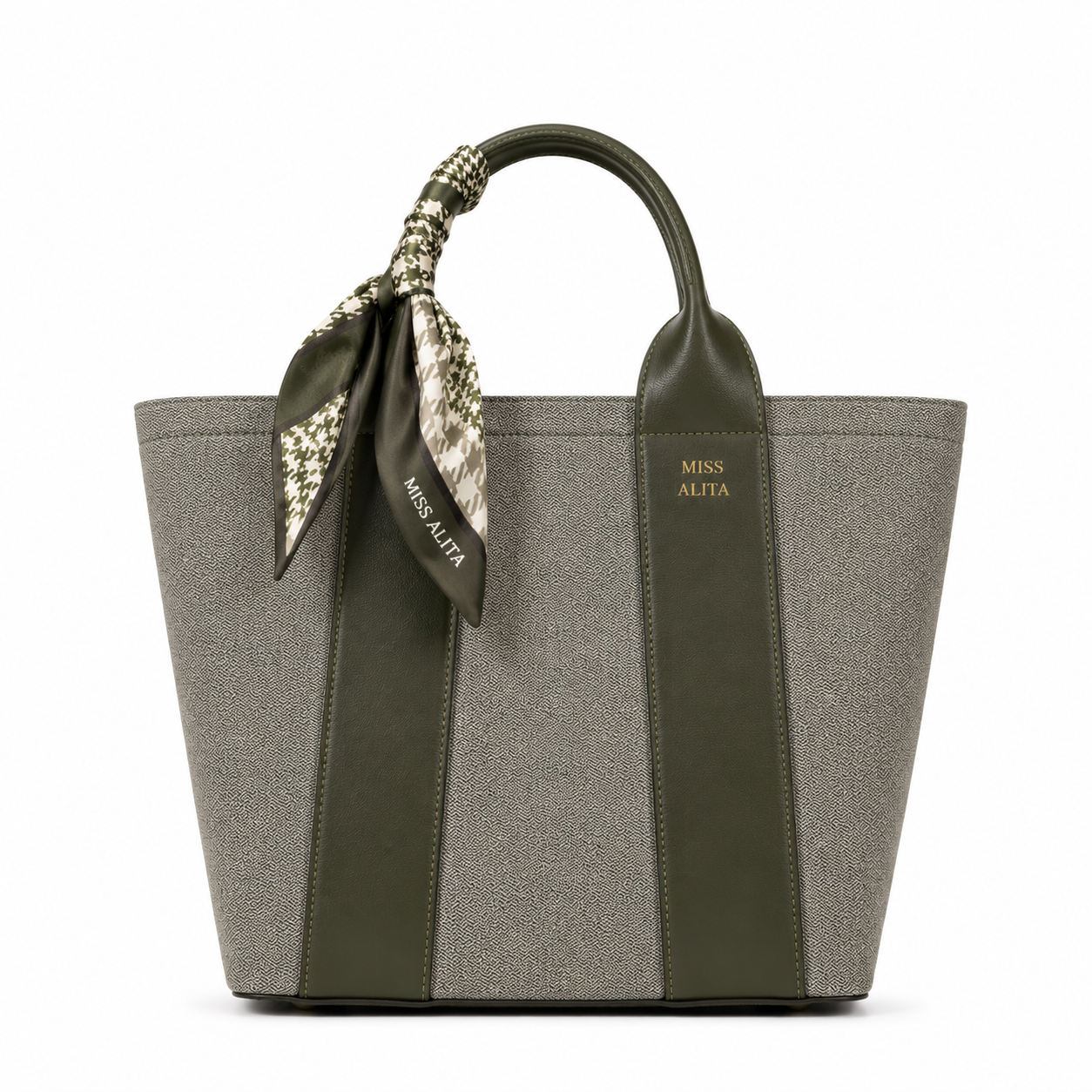 MISS ALITA green canvas tote handbag with olive green leather trim, decorative silk scarf handle, structured design, and gold logo on a white background.
