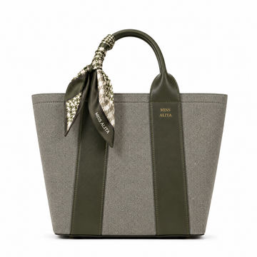 MISS ALITA green canvas tote handbag with olive green leather trim, decorative silk scarf handle, structured design, and gold logo on a white background.