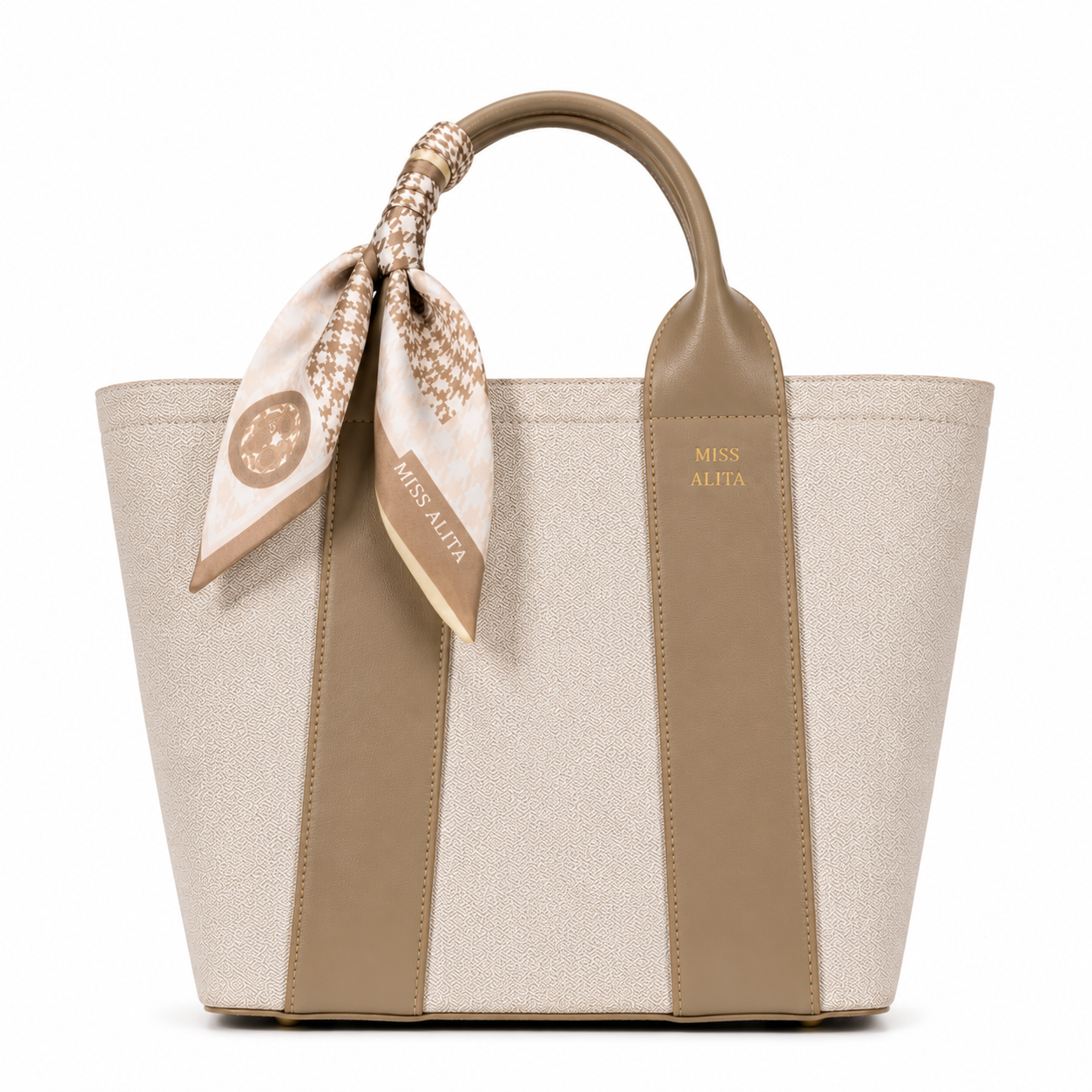 MISS ALITA khaki canvas tote handbag with matching leather trim, decorative silk scarf handle, structured design, and gold logo on a white background.