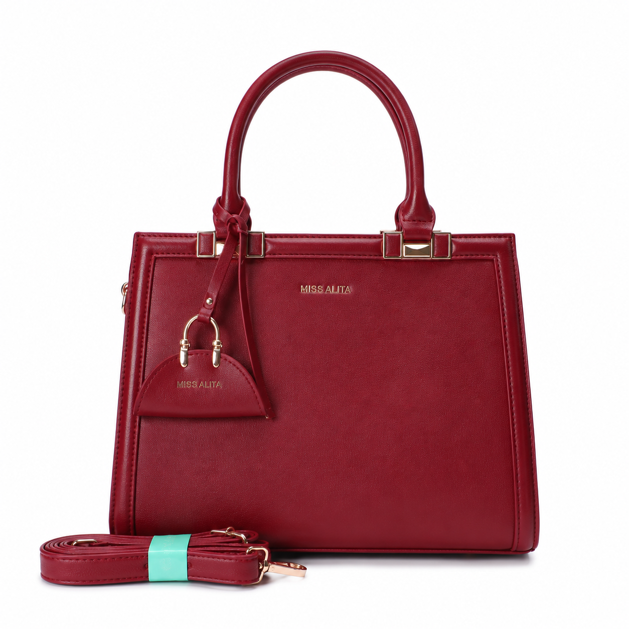 MISS ALITA burgundy structured top handle handbag with gold-tone hardware, detachable shoulder strap, and matching charm on a white background.