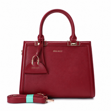 MISS ALITA burgundy structured top handle handbag with gold-tone hardware, detachable shoulder strap, and matching charm on a white background.