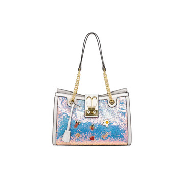 Pastel blue, pink, and white sequin tote bag with white trim, gold chain handles, decorative charms, and structured silhouette on a white studio background.
