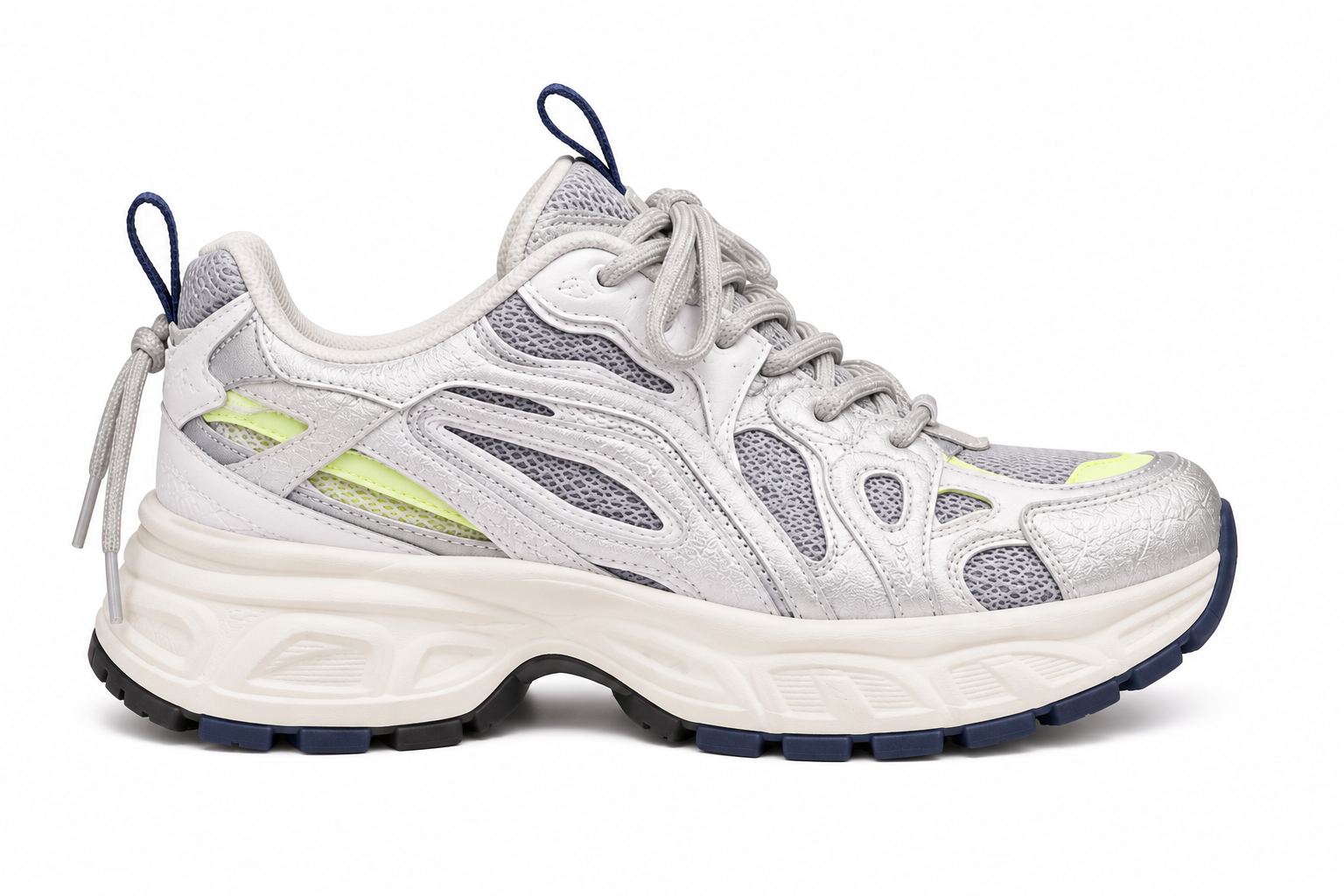 A chunky low-top sneaker in metallic silver and white with lime green accents and navy blue details, shown from a side profile on a white background.