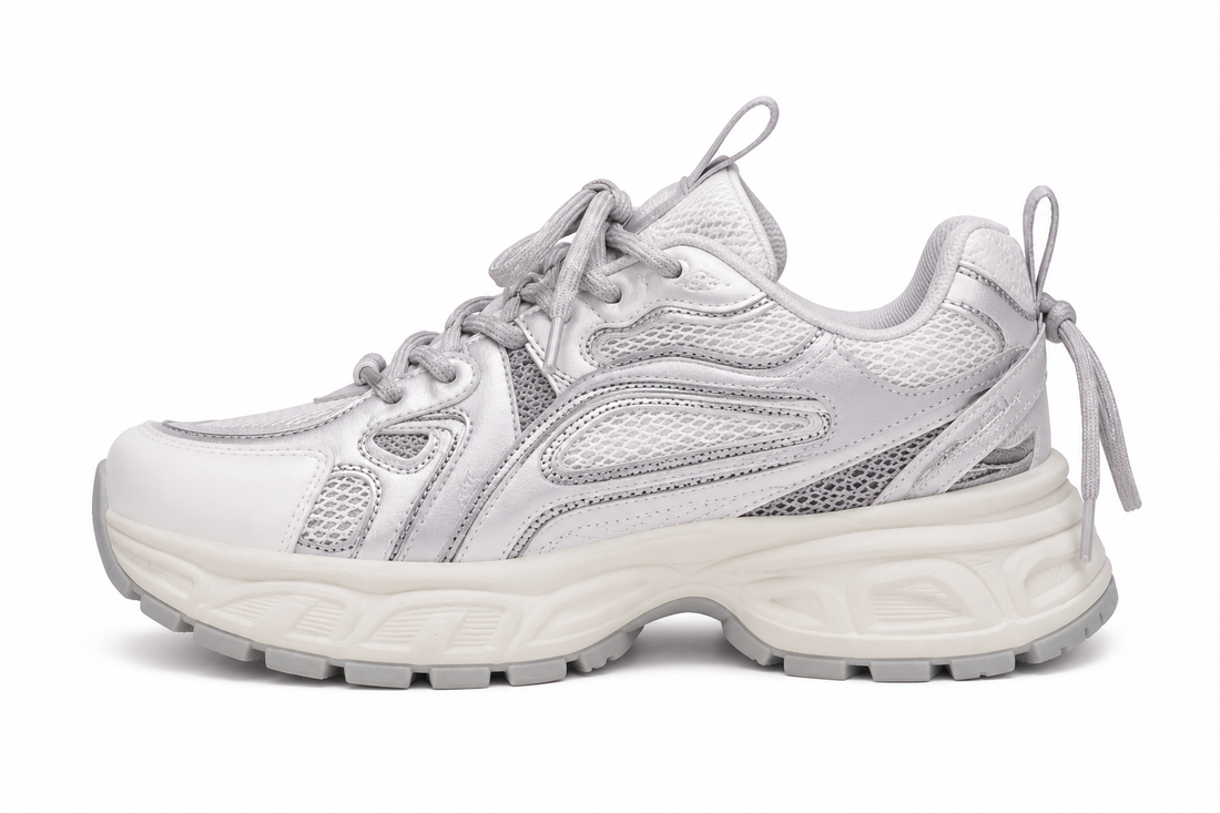 Women's light gray chunky running sneakers with breathable mesh upper and cushioned sole.