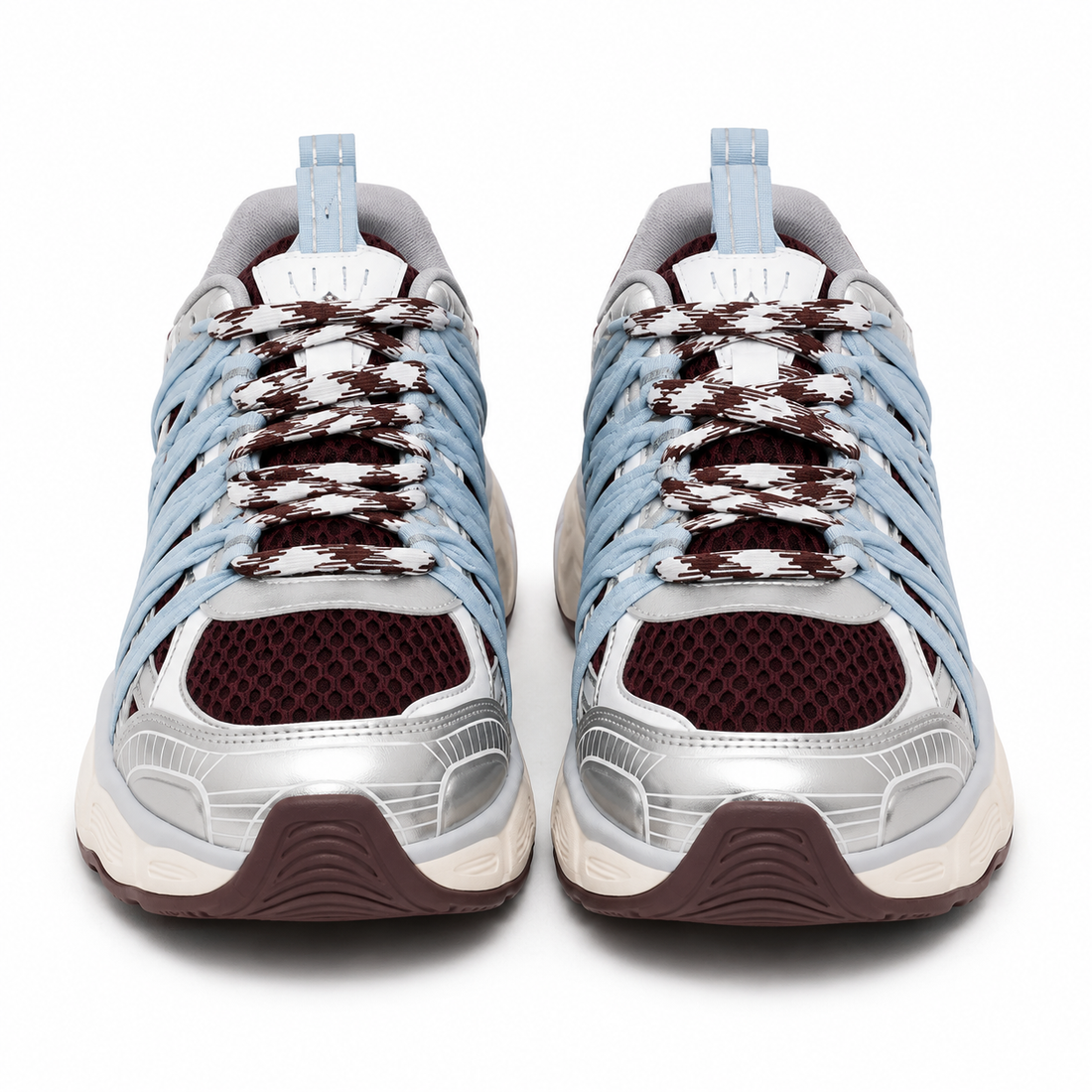 A pair of low-top athletic sneakers shown from the front on a white background. The shoes feature light blue synthetic overlays, a white mesh upper, dark brown knit laces, a metallic silver toe bumper, and a dark brown outsole.