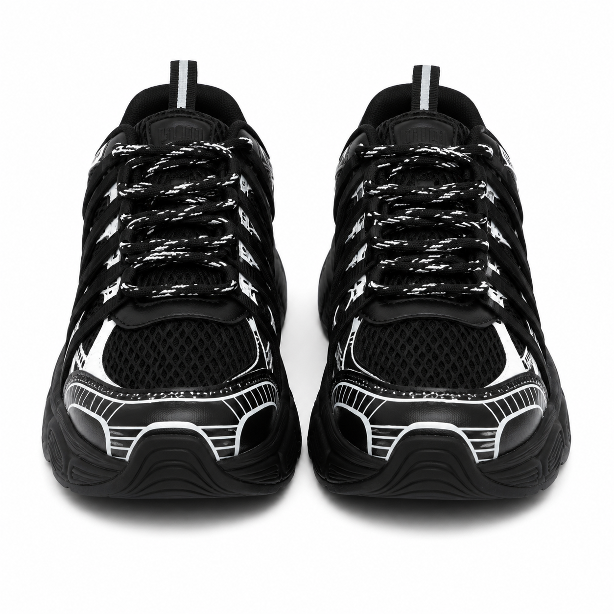 Women's chunky sneakers in black with white graphic overlays, breathable mesh upper, and thick cushioned sole.